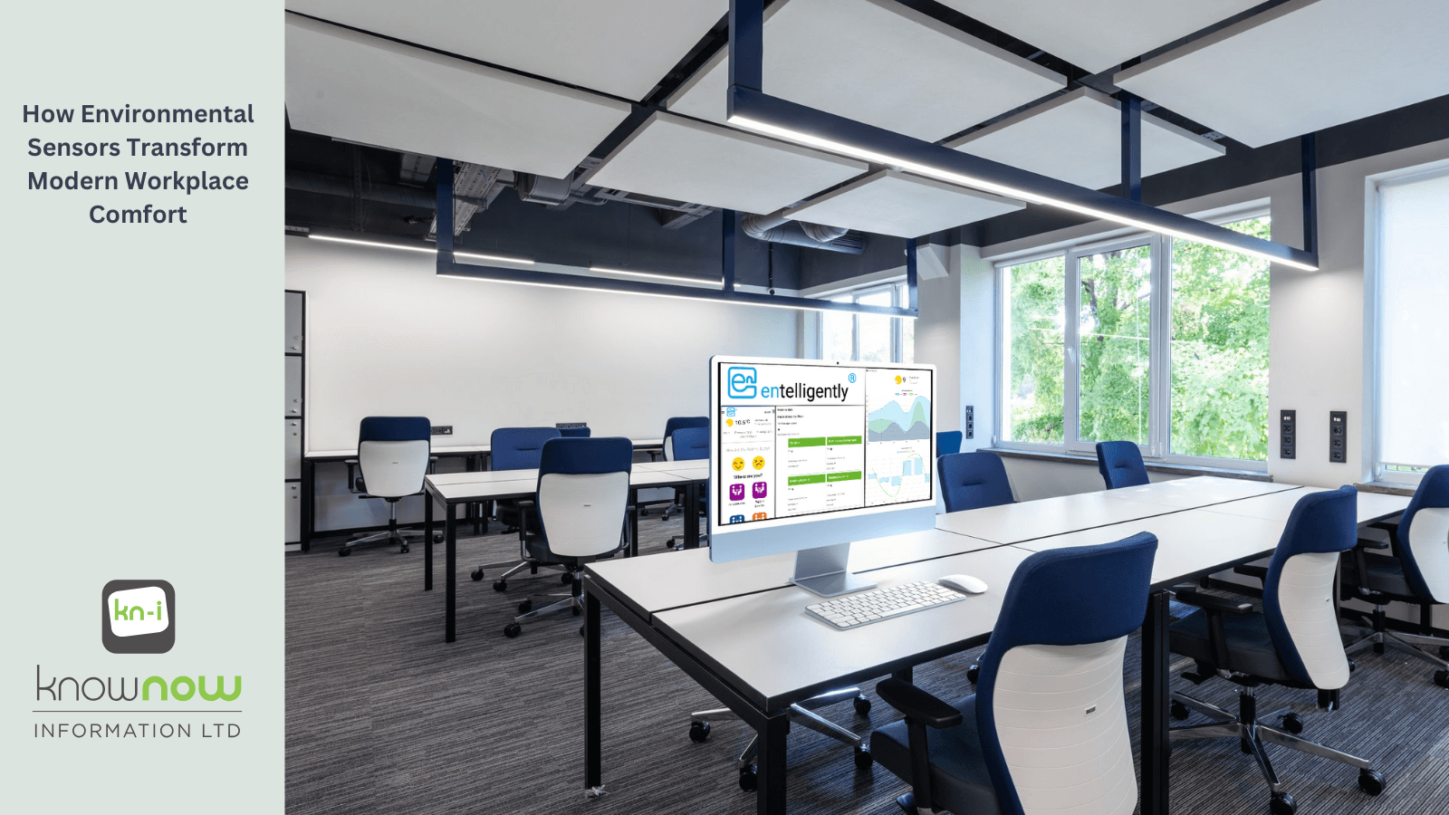 Modern office environment with empty workstations and large windows, with the Entelligently interface visible on a screen.